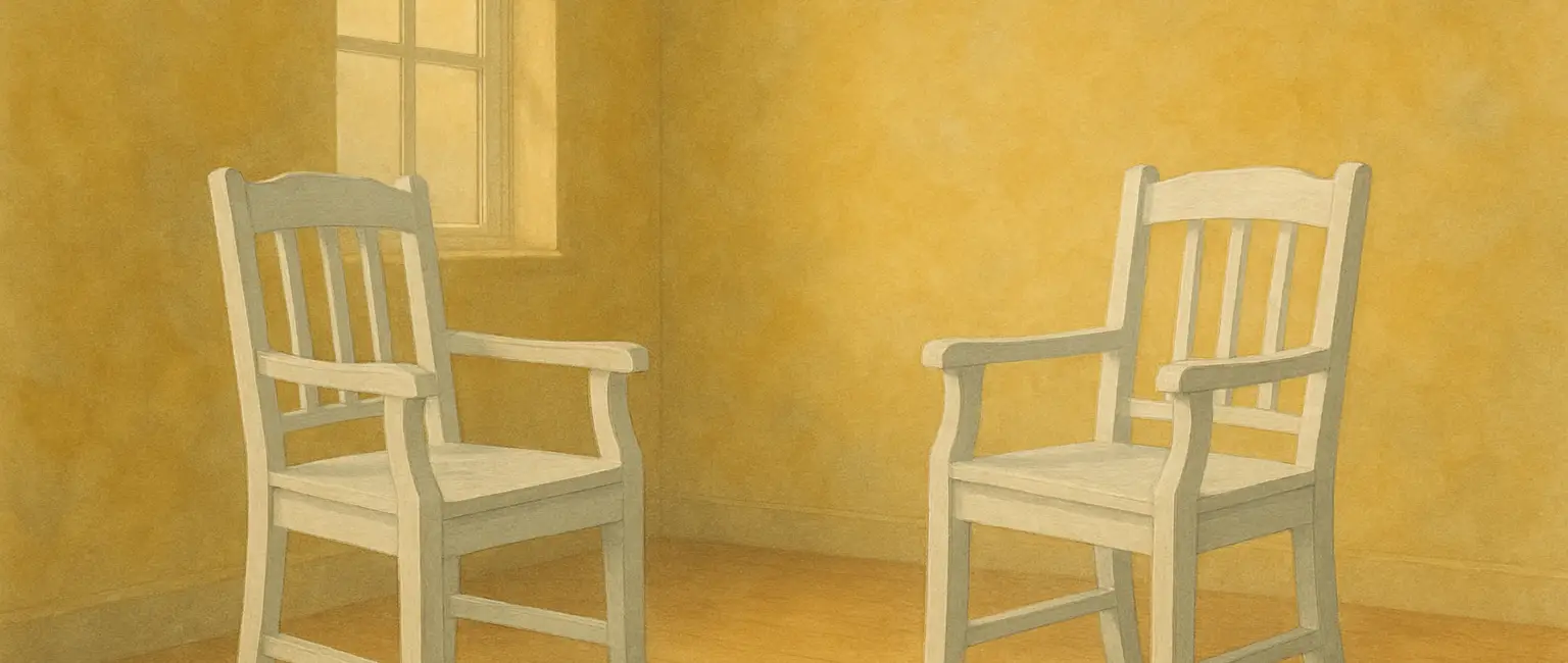Two empty chairs facing each other