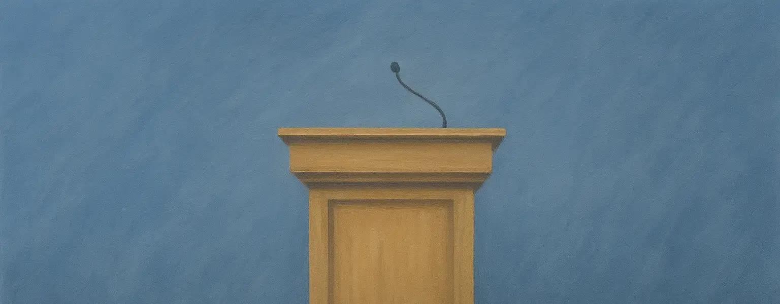 A debate stand in front of blue backdrop.